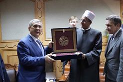 Image may contain: 4 people, people smiling, people standing and indoor